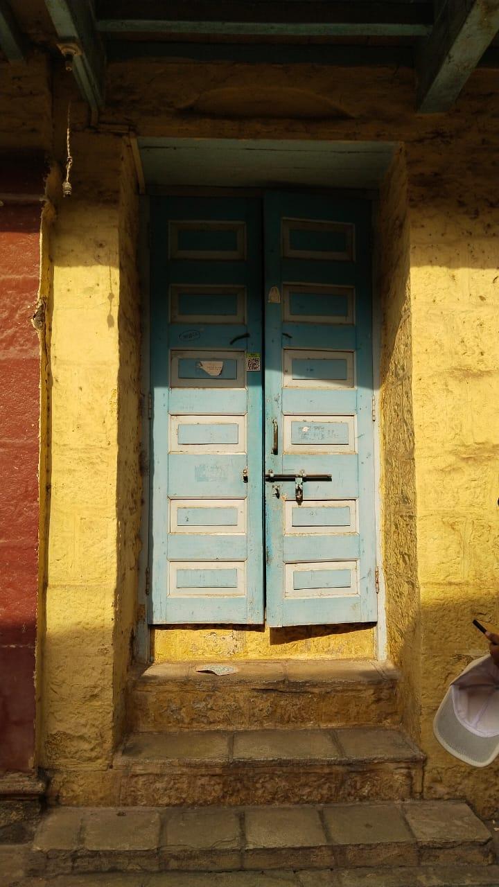 A blue-colored door which matches the shade of the beautiful decorative elements that adorn the second storey. (Source: CKA Archives)