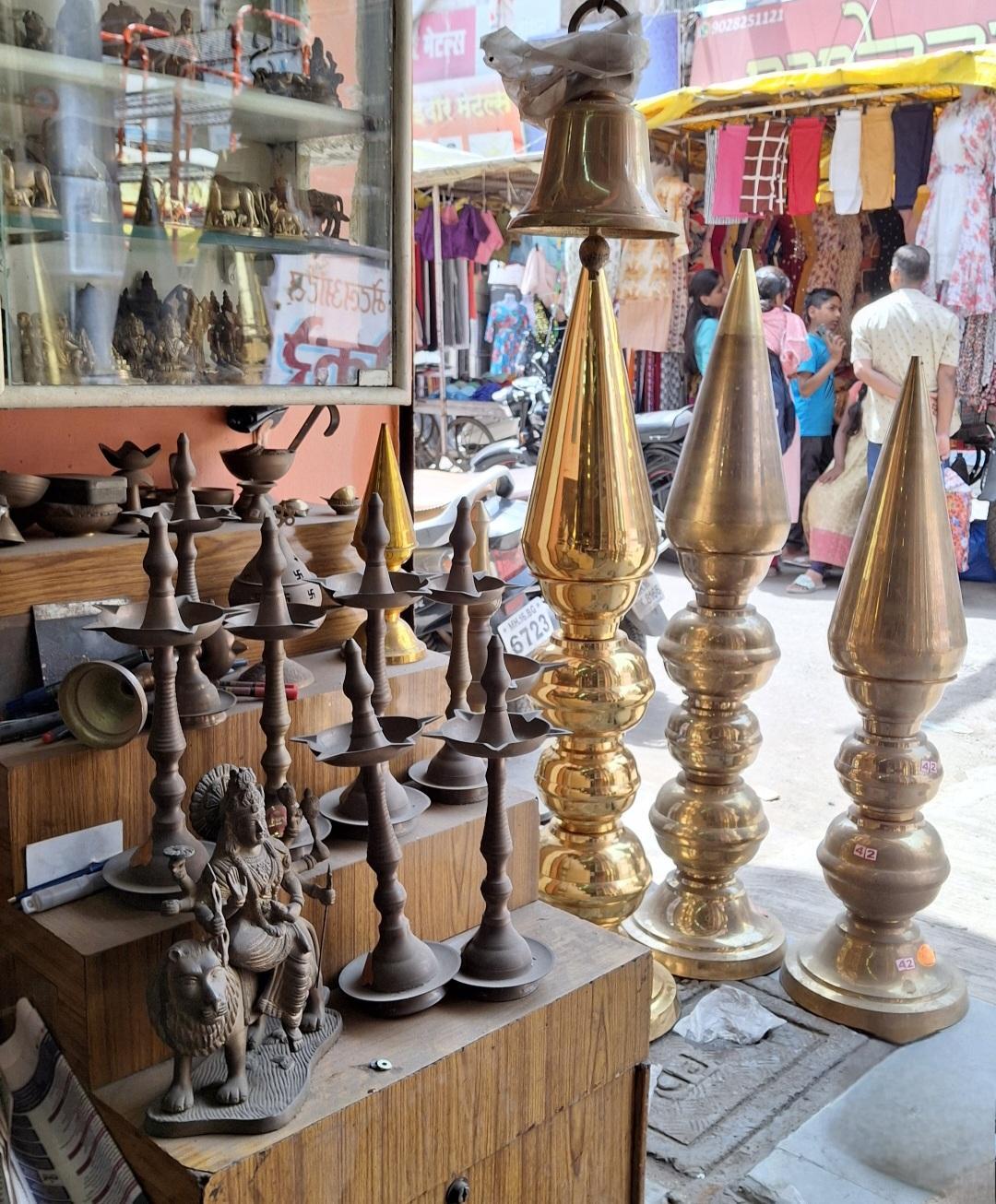 Scattered along Shahaji Raje Road in Nalegaon, the shops are packed with antiquetaal,jhanj, old brassware, murtis, and more. (Source: CKA Archives)