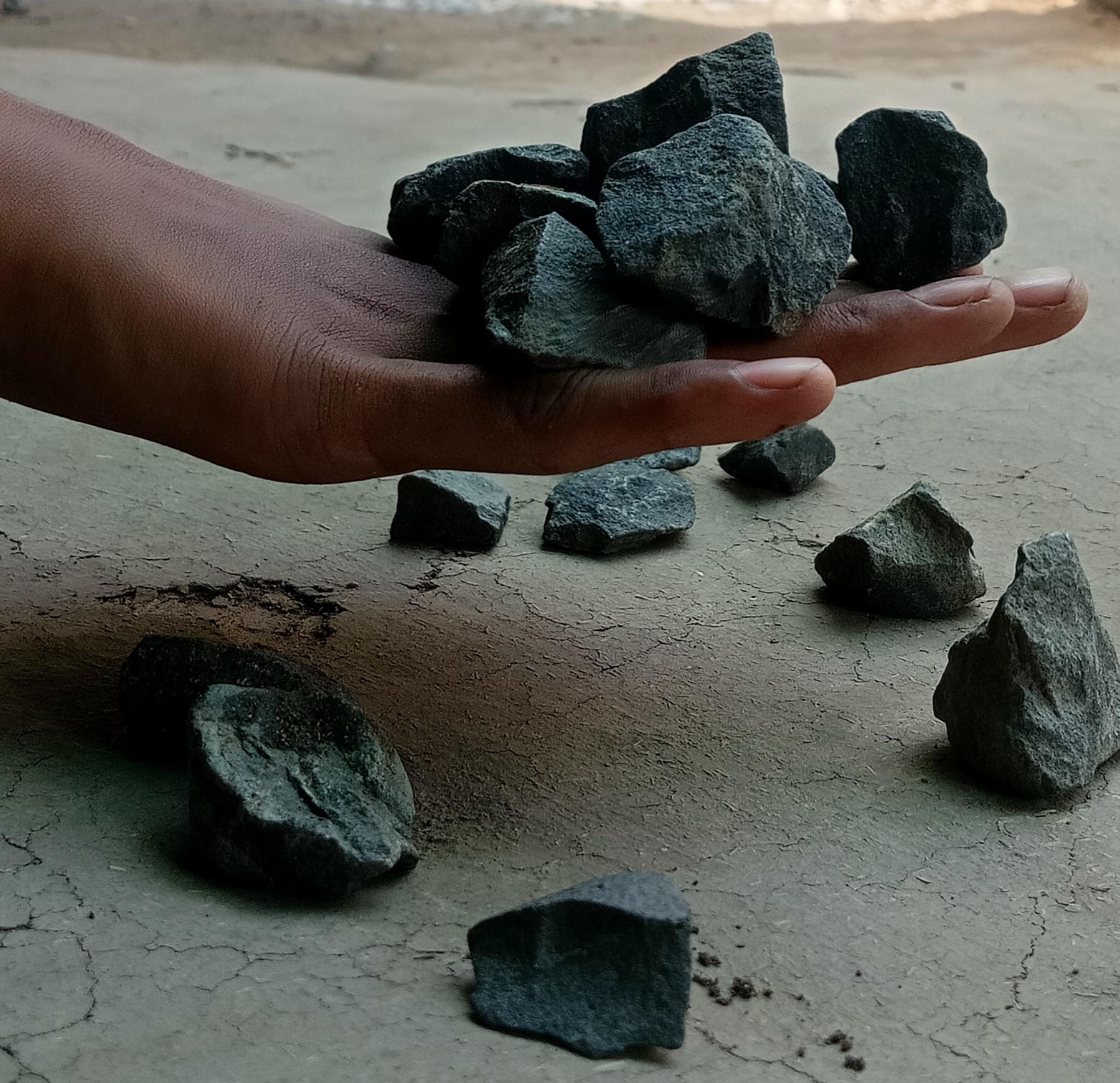 Khade is a traditional game played with a small stone. To begin the game, players take the stone and throw it up, catching it on the dorsal side of the hand. They continue by throwing the stone up again and catching it with the dorsal side of the hand. The stones are then placed in a corner, and the player throws them up once more, attempting to catch as many stones as possible. If a player fails to catch the stone, they are out, and it is the next player's turn (Source: CKA Archives).