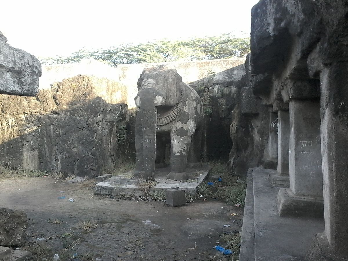 One of the remaining elephant sculptures at the entrance of Shivleni Caves, Ambajogai, Beed district. These life-sized carvings give the site its local name, Hattikhana.[2]