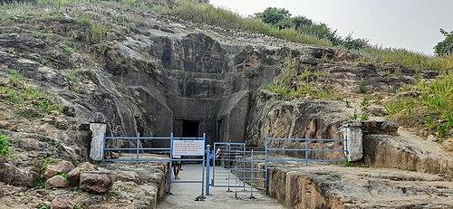 Entrance to the Vijjasan Buddhist Caves, with carved passageways and remnants of early Buddhist relief work.[1]