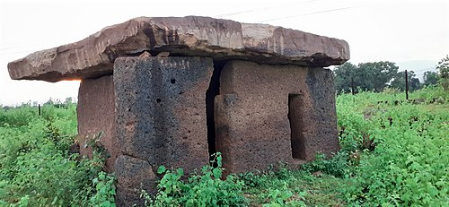 A dolmen burial structure at Hirapur village, made of large laterite slabs. Such megalithic forms indicate early settled life and ritual continuity over centuries in Chimur taluka of Chandrapur district.