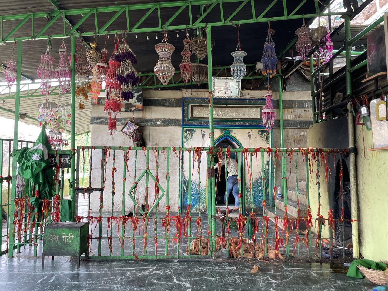 Mannat threads tied by visitors on the railing, each carrying a prayer or personal vow. (Source: CKA Archives)