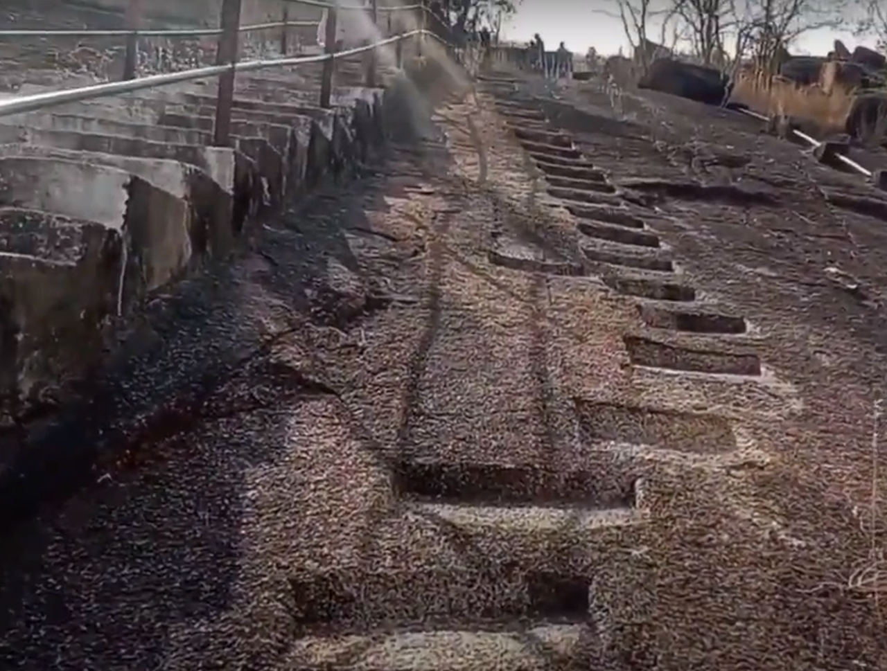 Older steps carved in stone are on the right, and newer concrete steps are on the left. (Source: CKA Archives)