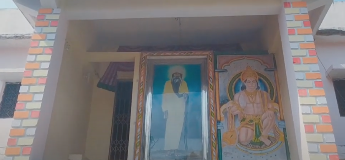 A Photograph of  Kartik Swami Maharaj holding his beard (Source: CKA Archives)