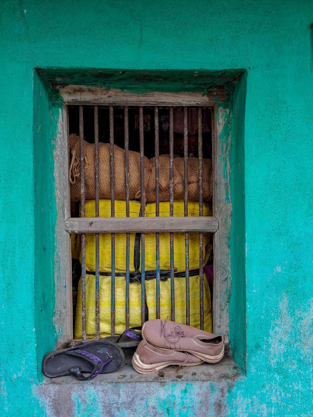 Some windows, as seen here, have wooden borders and iron rods. (Source: CKA Archives)