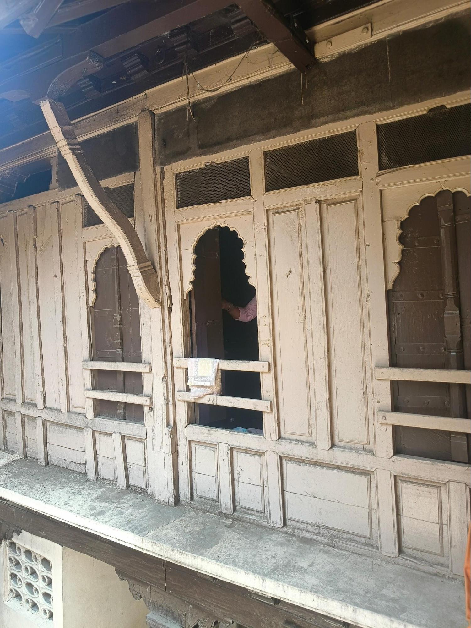 A street-facing perspective of a window with a similar window, illustrating how it integrates with the overall look of the exterior of the Wada. (Source: CKA Archives)