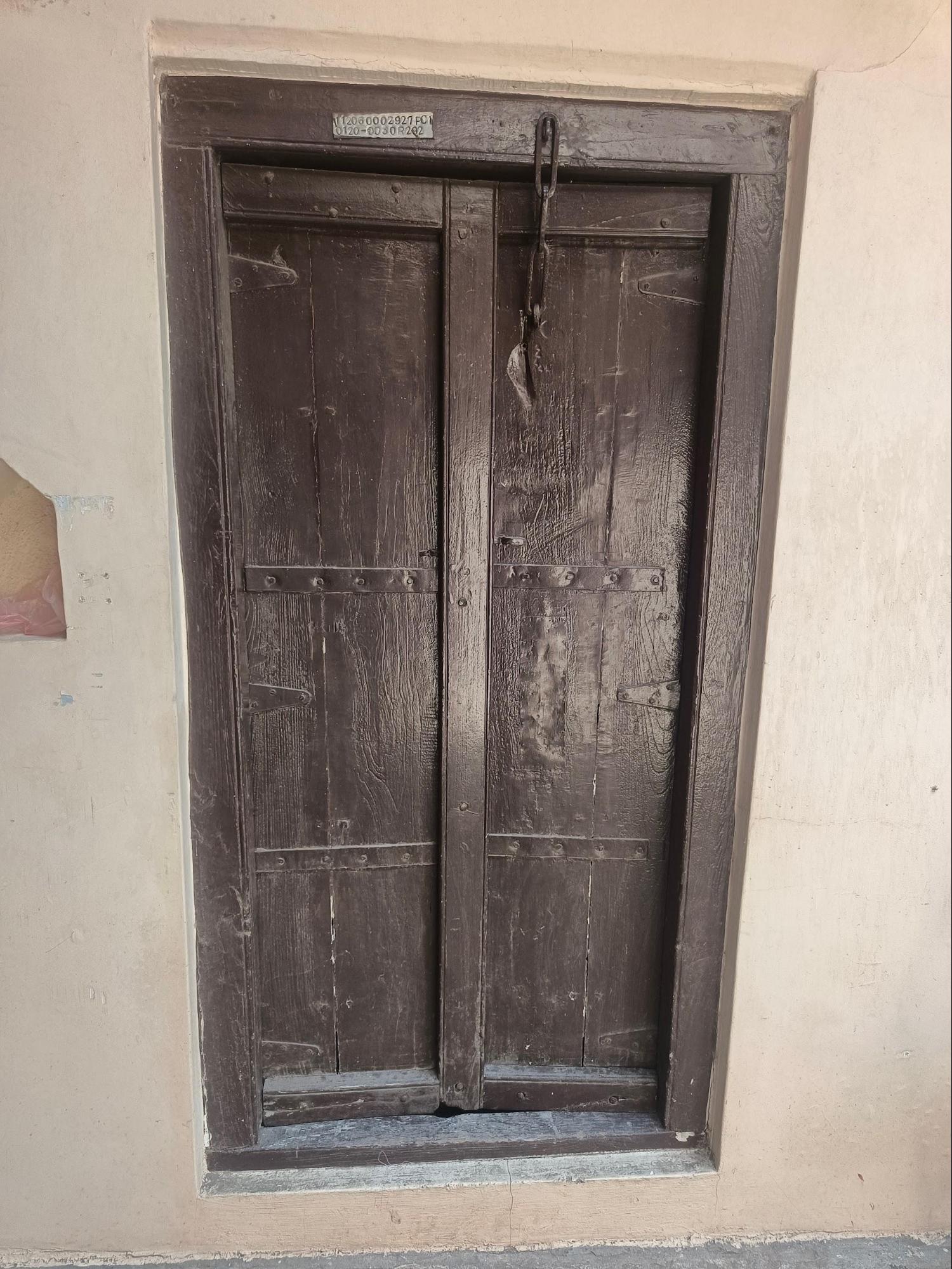 Another example of a wooden double-leaf door, with meticulous craftsmanship that speaks to the fading artistry of Wada architectural design." (Source: CKA Archives)