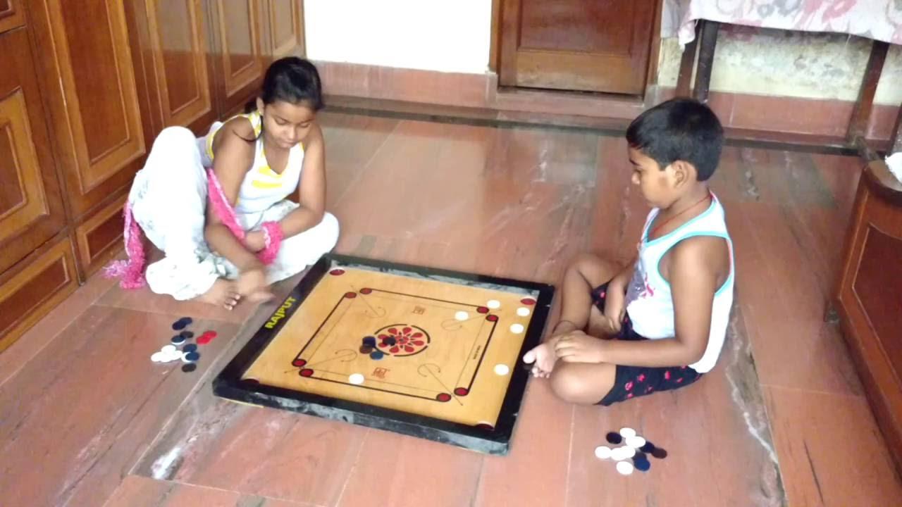 Carrom being played by children, (Source: CKA Archives).