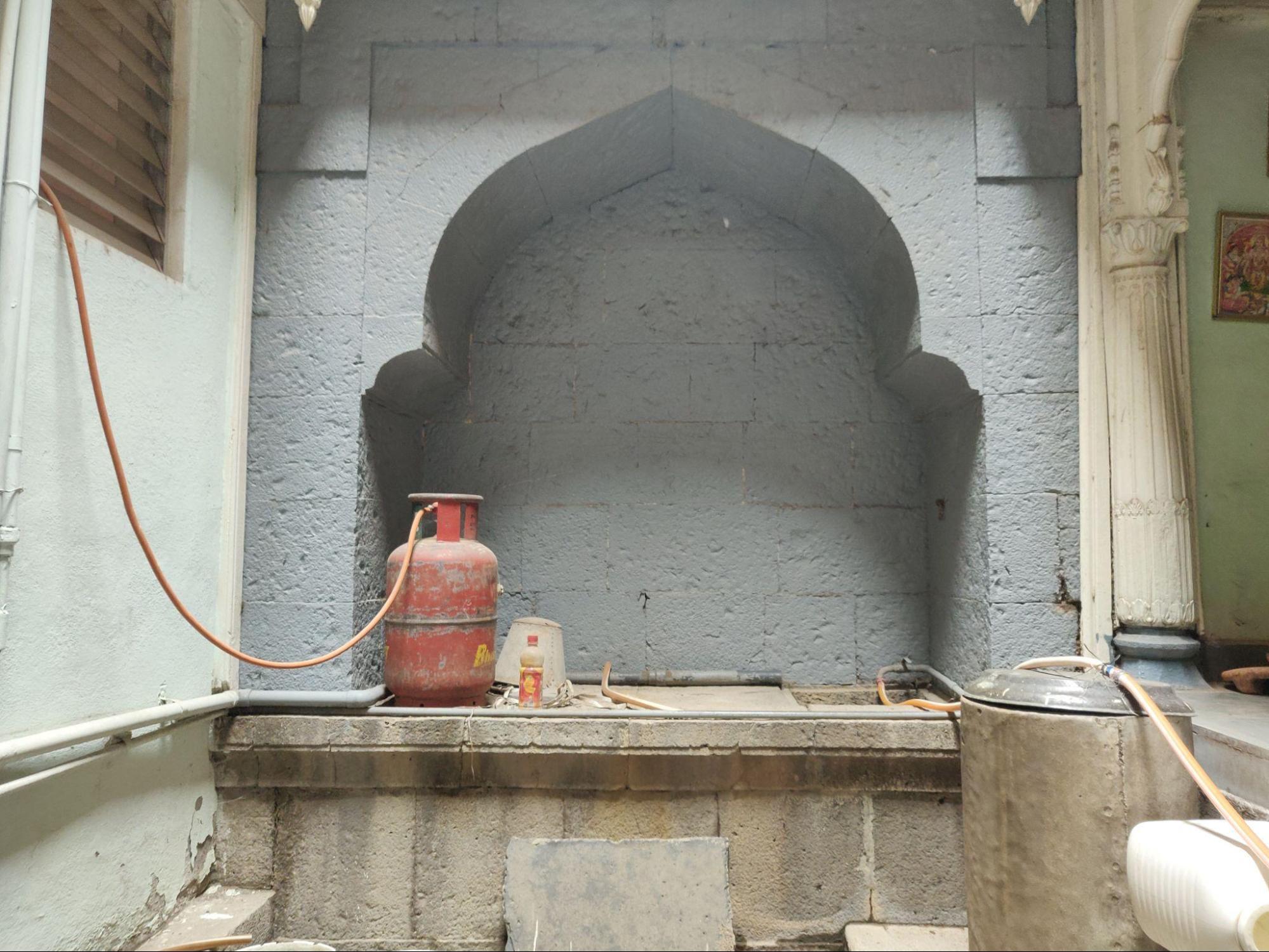 The courtyard's functional design includes provisions for water collection and storage essential for daily domestic activities. (Source: CKA Archives)