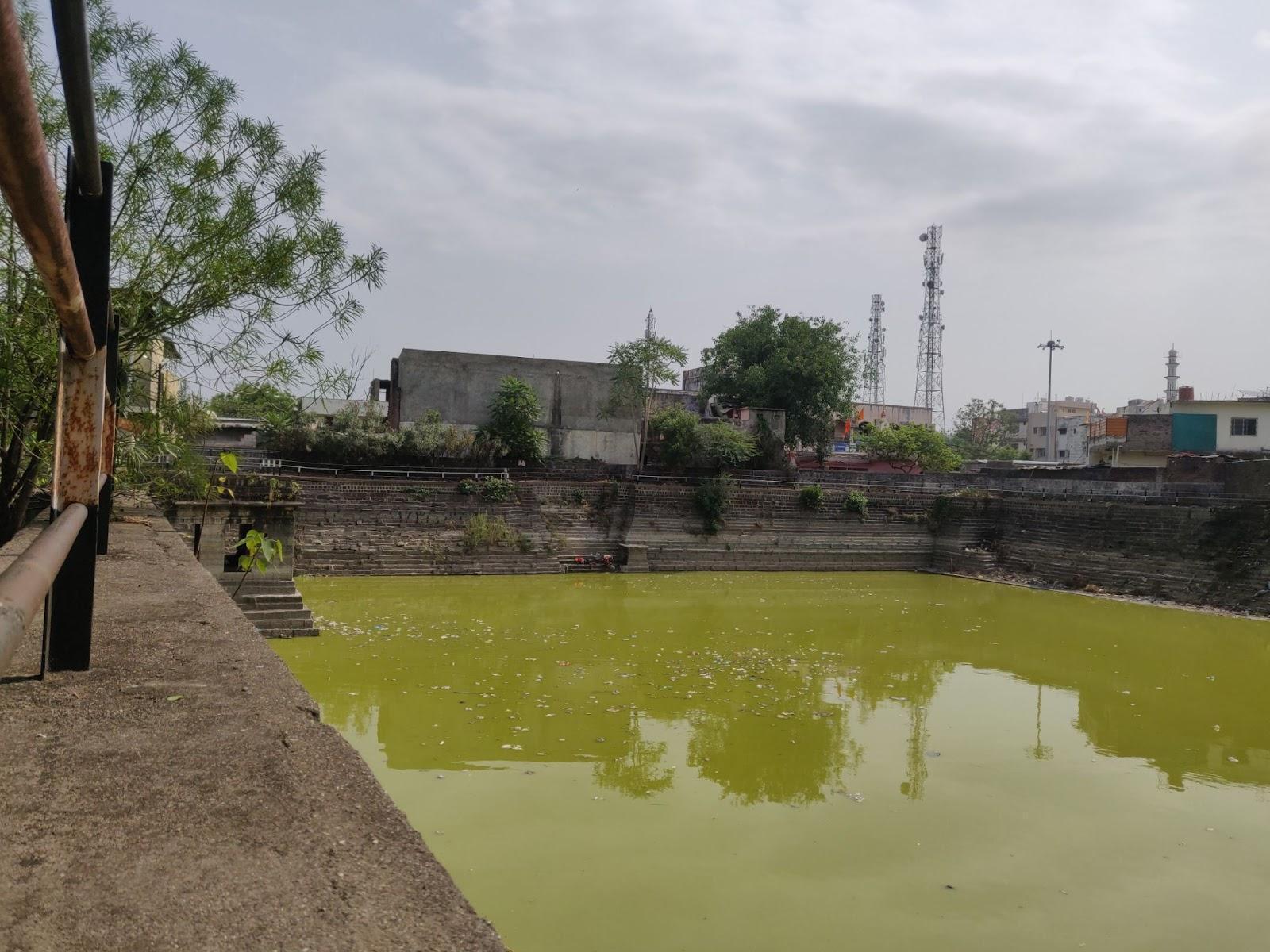 Wide view of the Pokharni Stepwell showing its expansive square layout. (Source: CKA Archives)