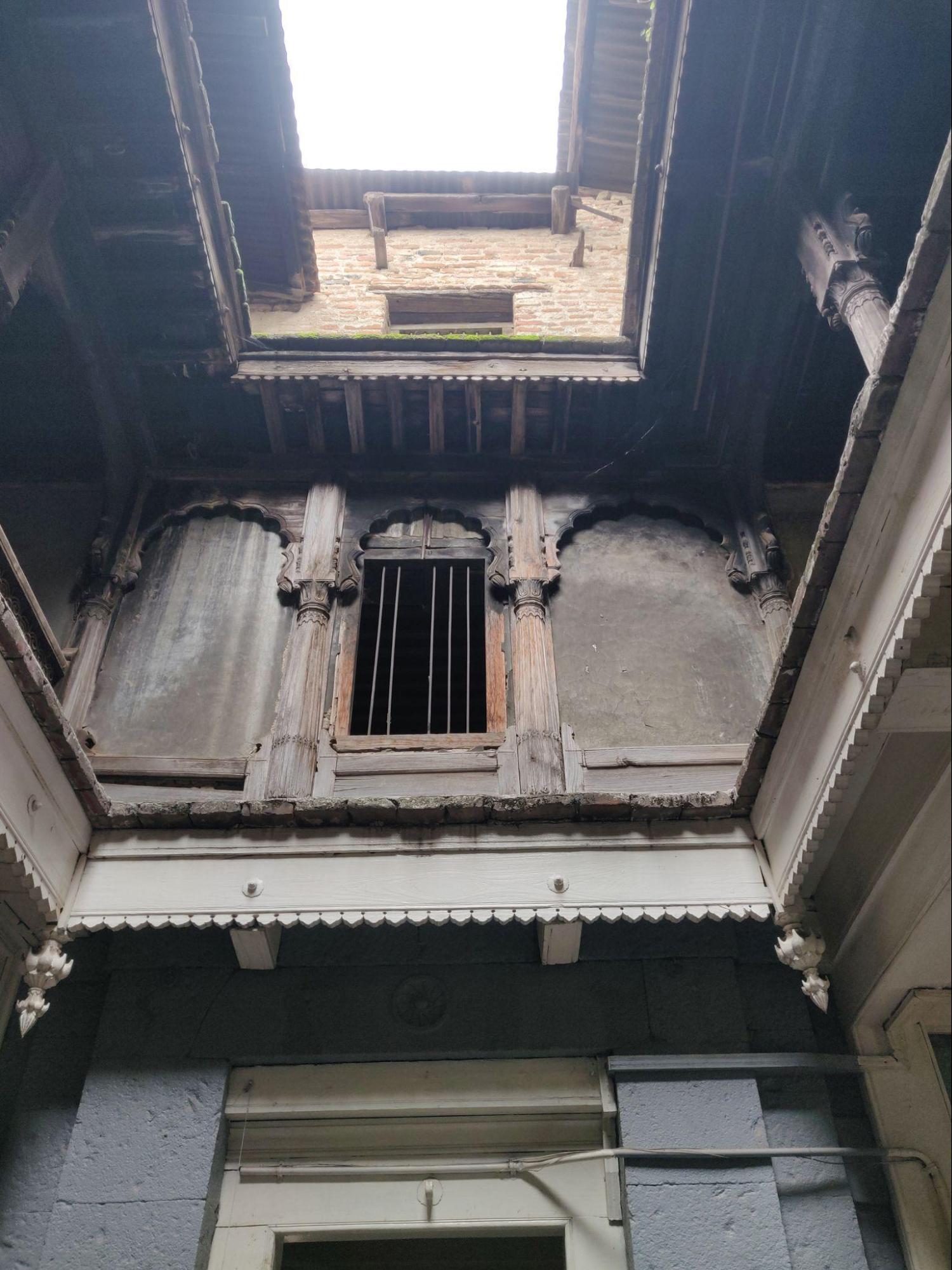 Window on the inner side of the wada showing the relationship between the window and the surrounding wooden decorative elements of the wall. (Source: CKA Archives)