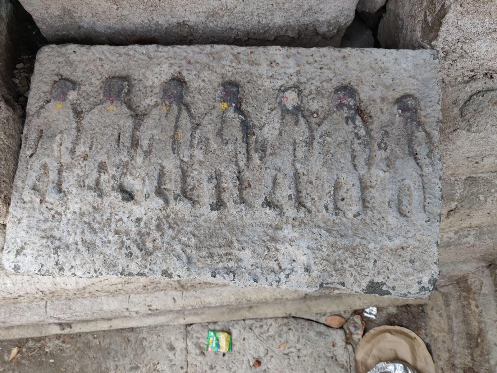 During a recent excavation, this stone was unearthed, featuring a detailed carving of seven figures. (Source: CKA Archives)