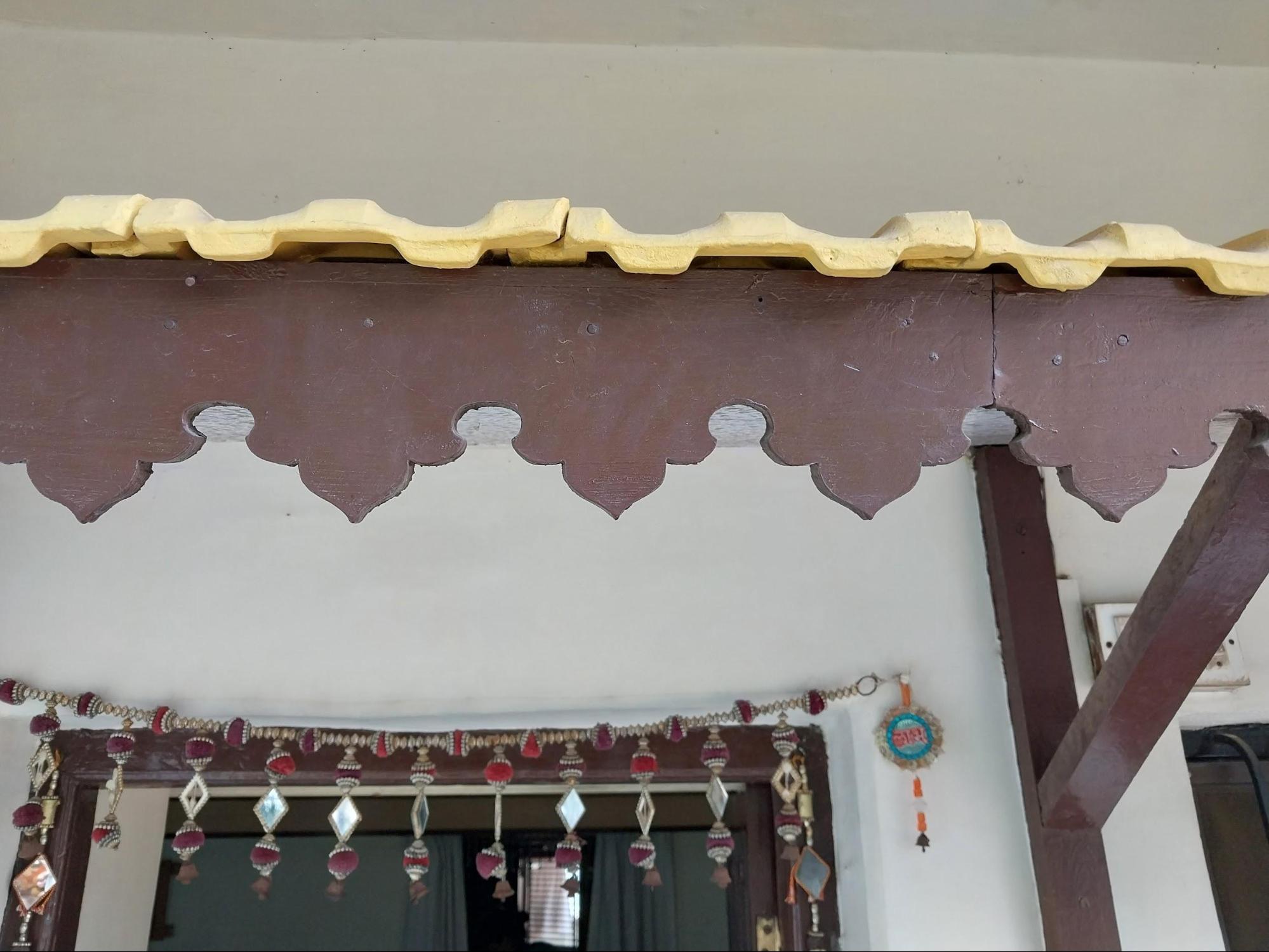 A close-up shows the detailed decorative work on the window overhang, revealing the craftsmanship that went into even functional parts of the home. (Source: CKA Archives)