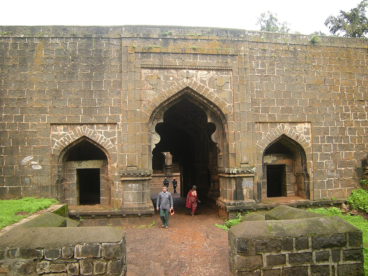A view of the Teen Darwaza (Konkani Darwaza) from the inner fort side, showcasing its imposing black stone structure and strategic military design.[7]