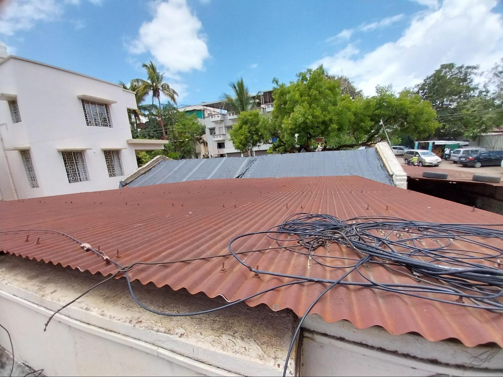 Corrugated sheets are used for the storage area’s roofing, distinguishing it from the primary structure. (Source: CKA Archives)