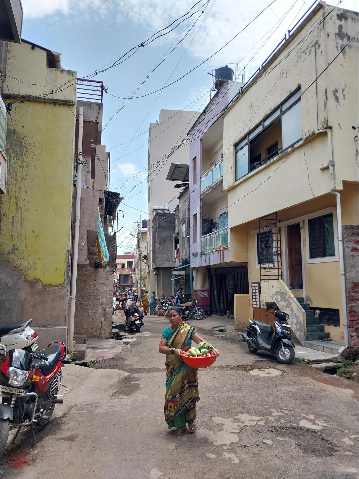 Street view of Sarnaik Galli showcasing the closely packed houses and intimate neighborhood setting.(Source: CKA Archives)