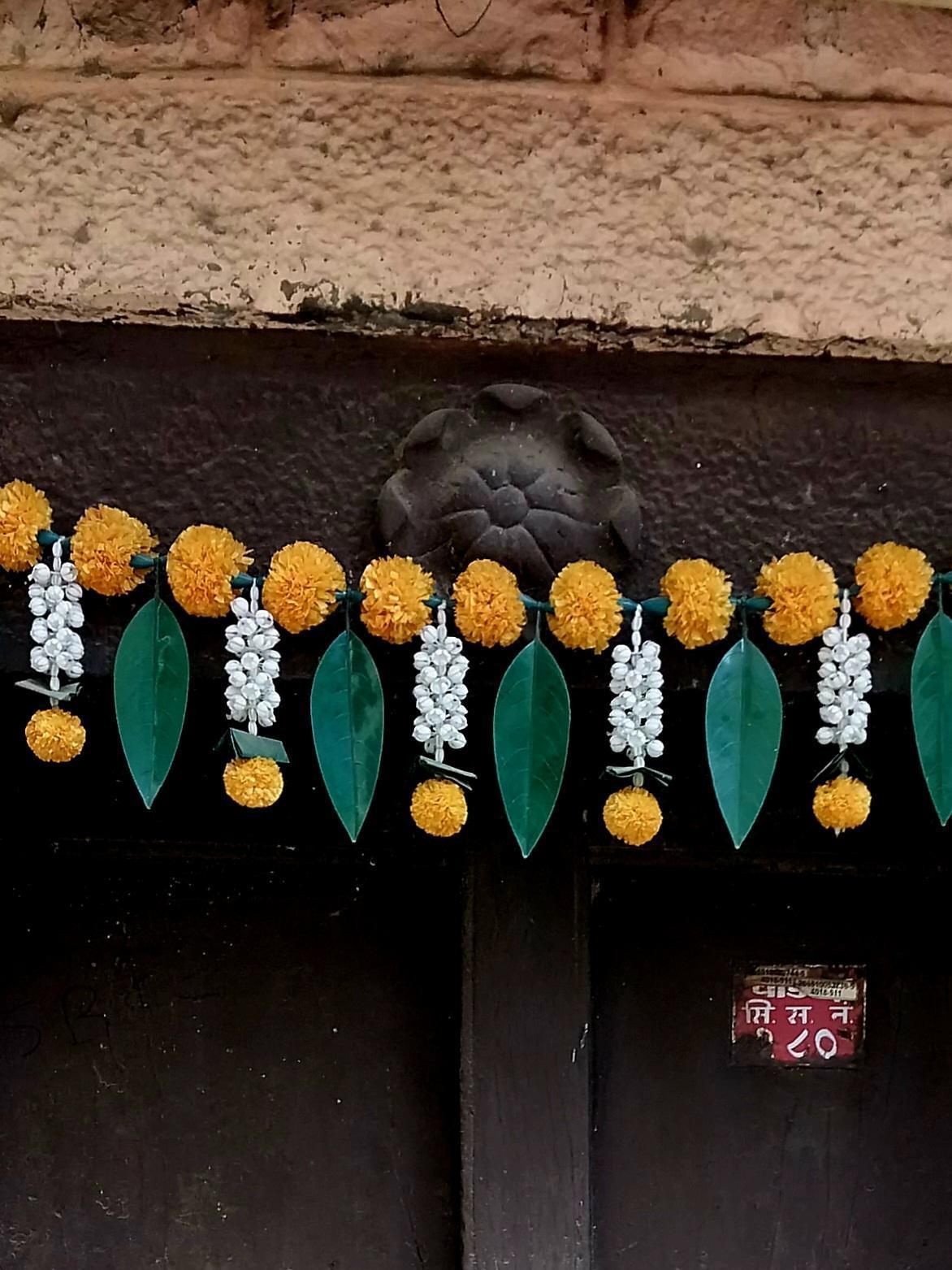The floral carving at the choukat (top) of the entrance door.(Source: CKA Archives)
