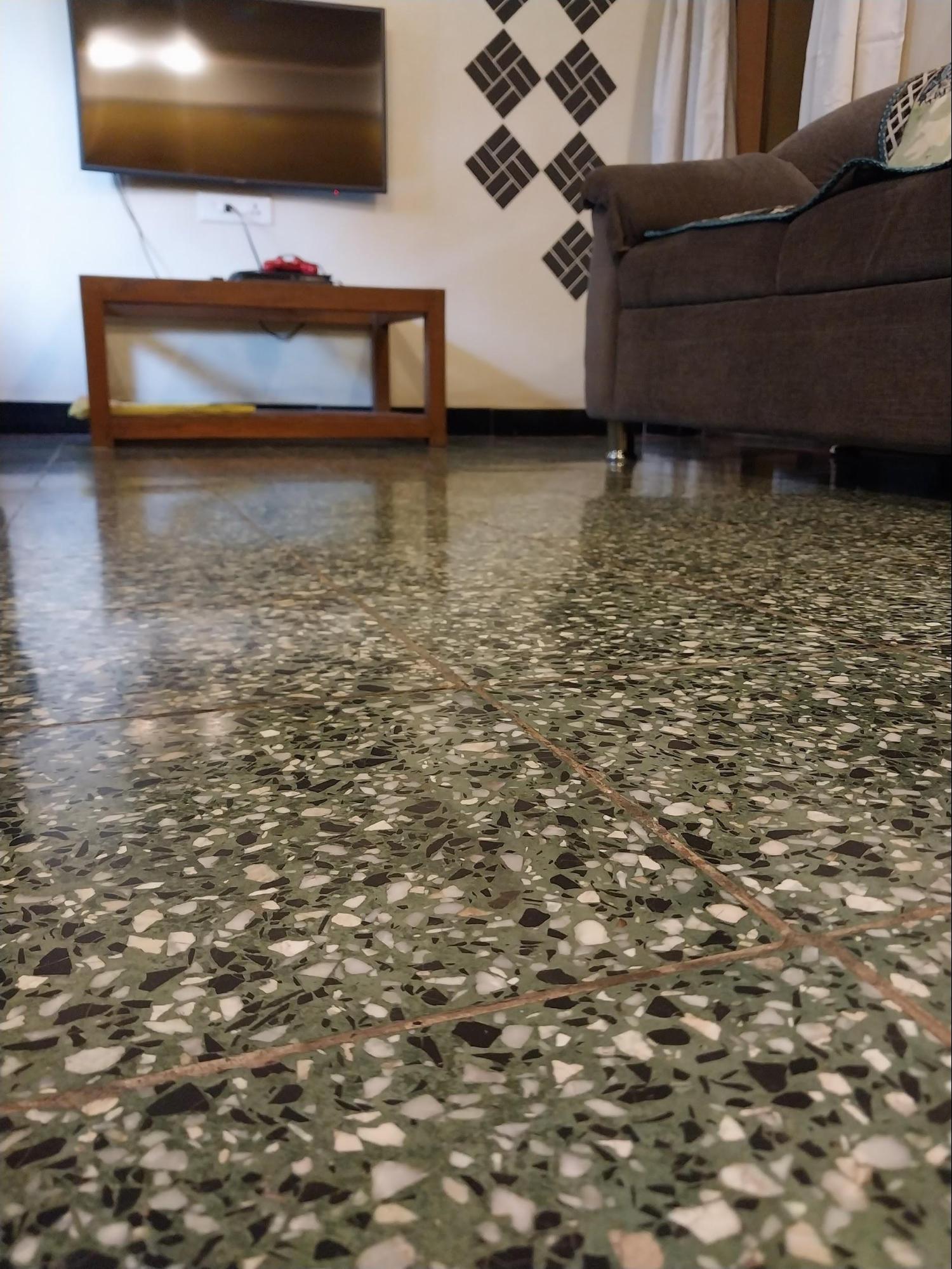 The hall flooring consists of mosaic tiles, which were commonly used across semi-urban and urban areas throughout India during the late 20th century, representing typical material choices of the period. (Source: CKA Archives)