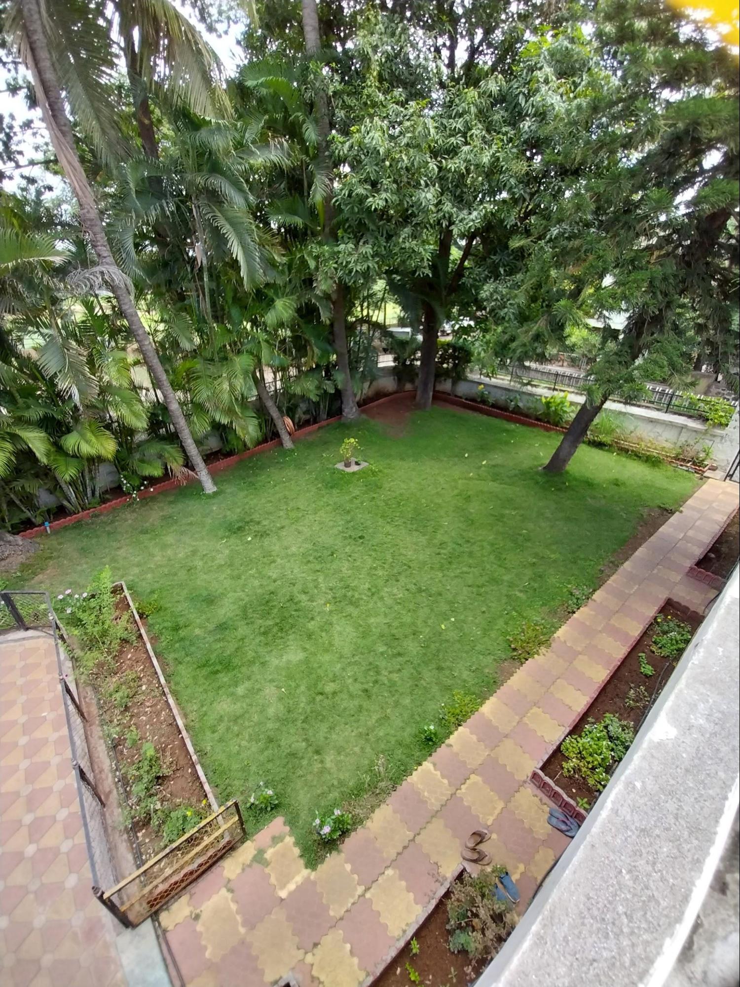 The landscaped front yard creates a green transition space between the street and the house. (Source: CKA Archives)