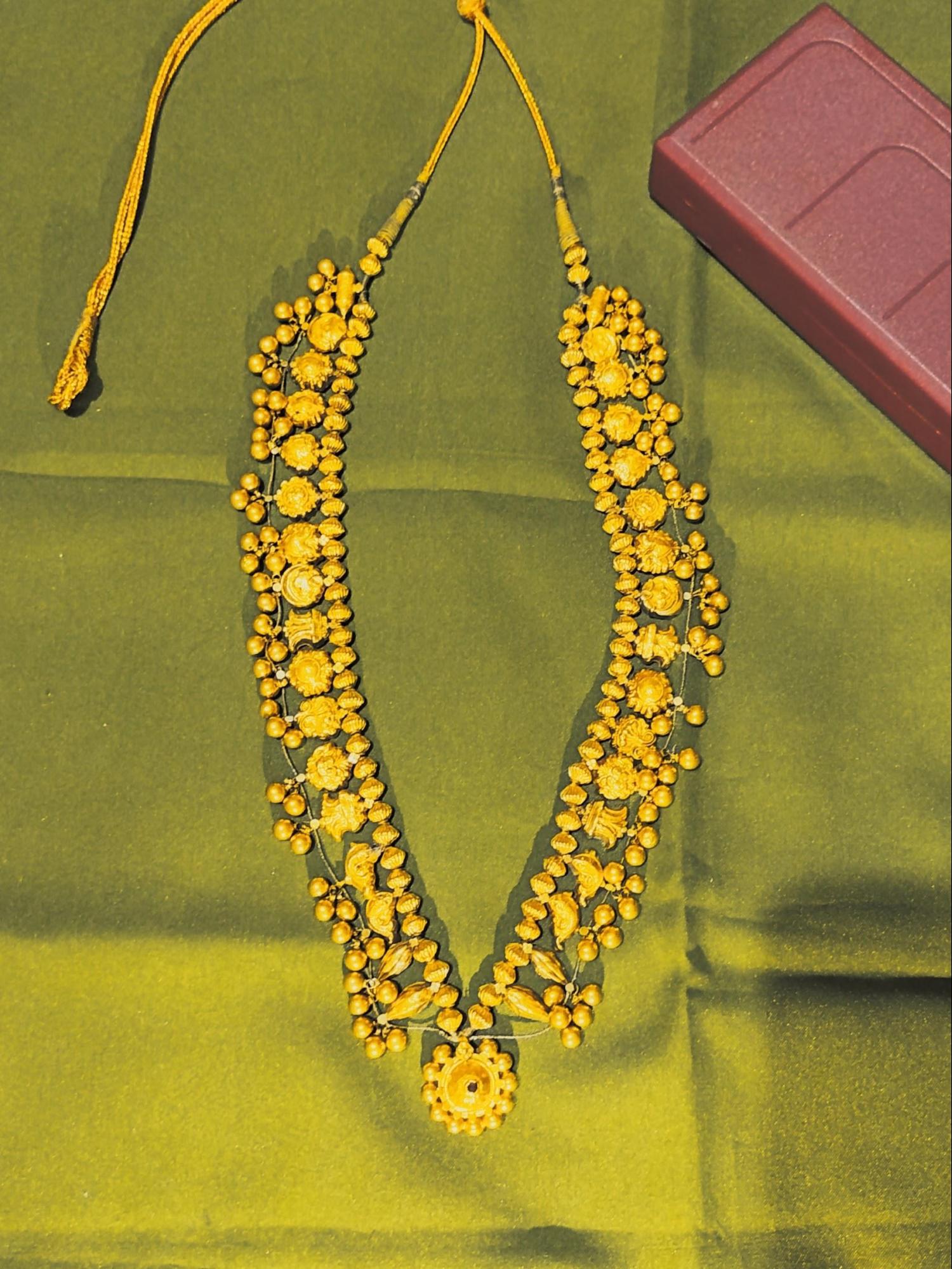 A Kolhapuri saaj featuring detailed gold work and traditional motifs, crafted by local artisans. Source: CKA Archives
