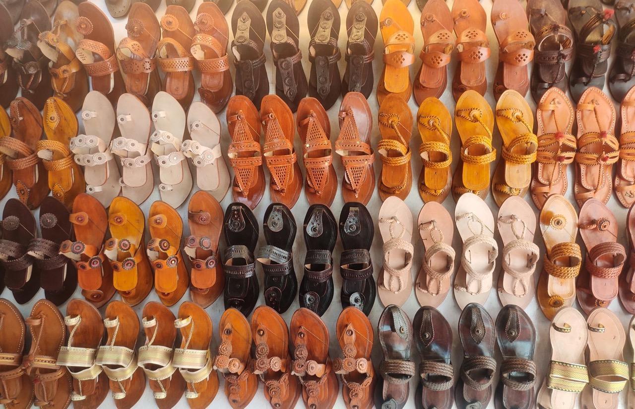 Kolhapuri Chappals, with their different styles displayed on the walls of a shop. Source: CKA Archives