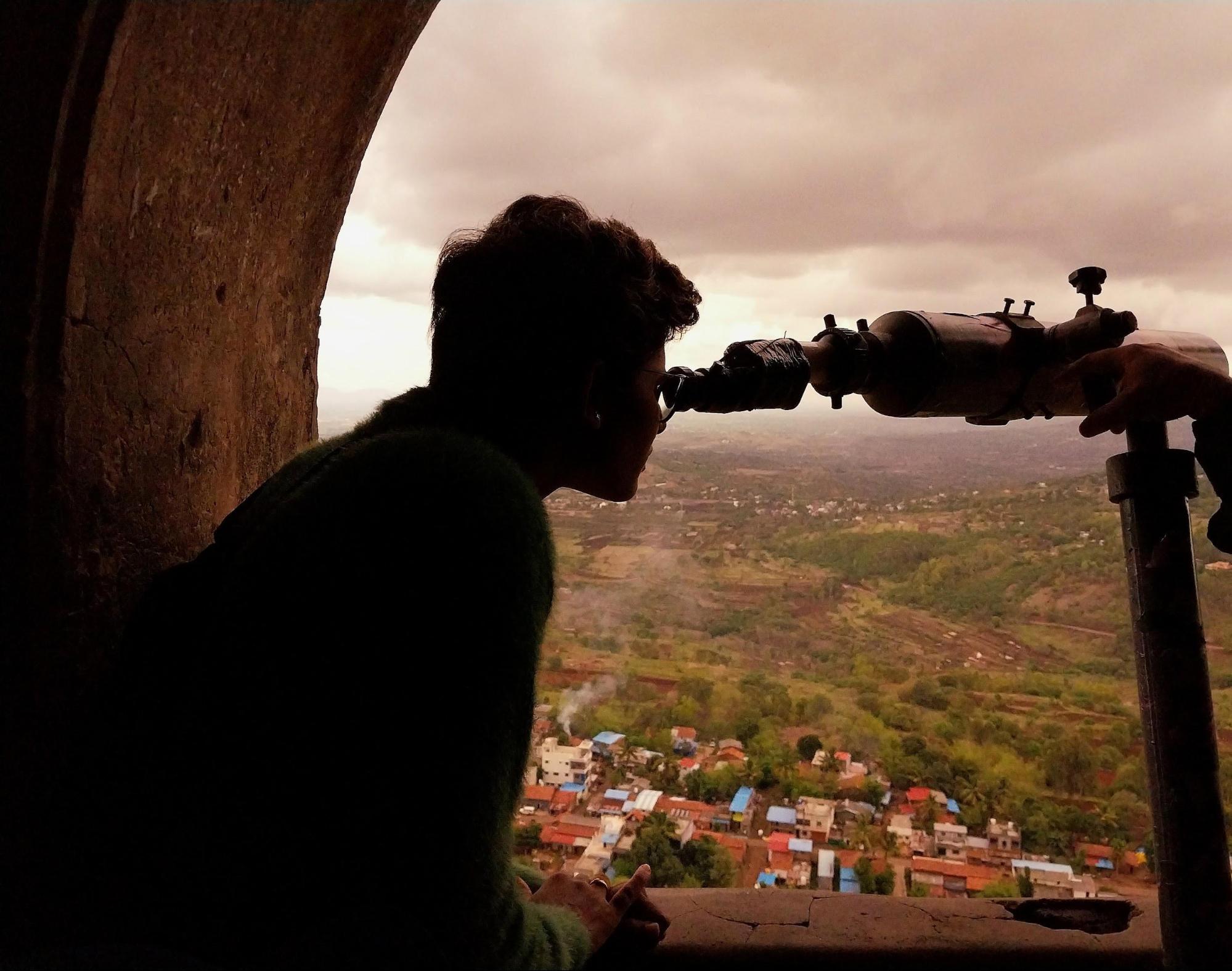 A telescope positioned on the top floor of Panhala Fort offers a clear view of landmarks such as the Narveer Shiva Kashid Statue, Pavangad Laxmi Mandir, and Kala Buruj. (Source: CKA Archives)