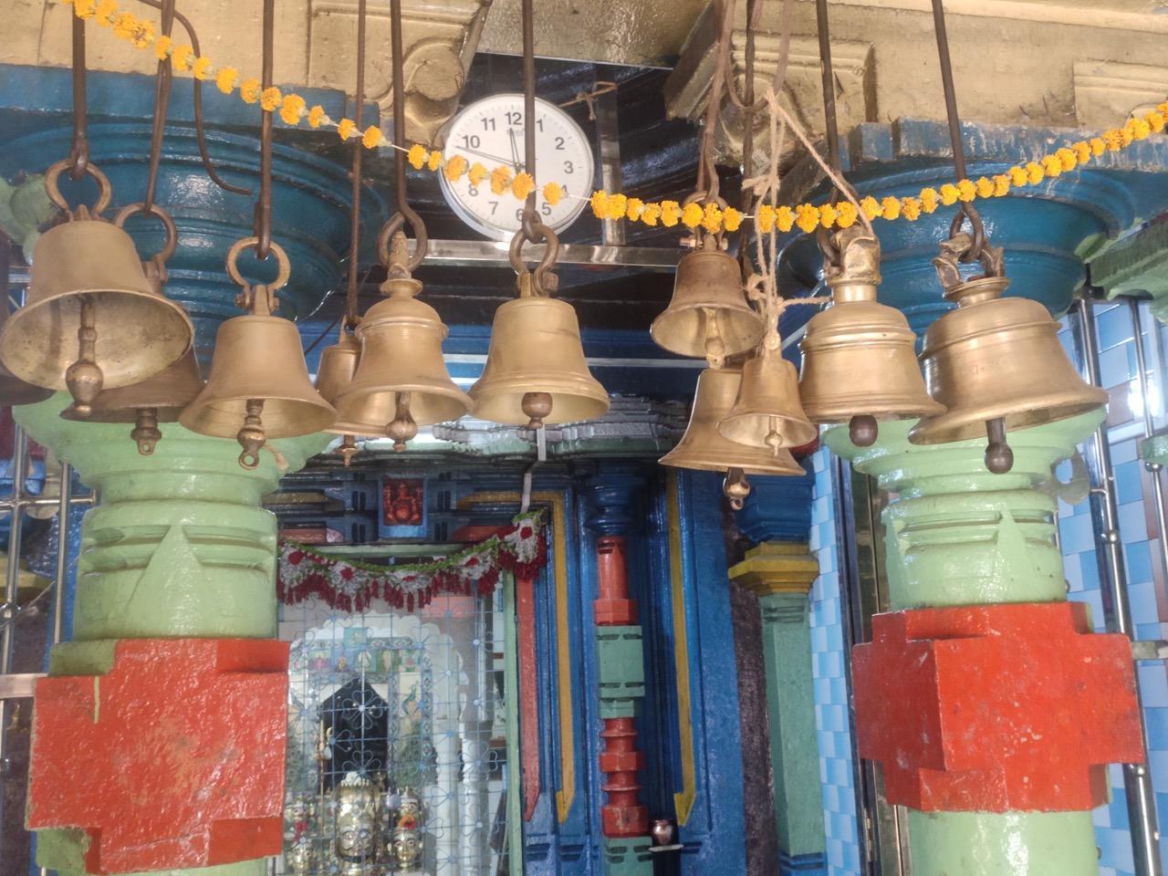 Various-sized bells hang above the entrance to the inner sanctum of the mandir. (Source: CKA Archives)