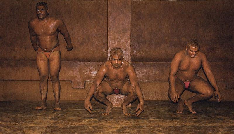 Wrestlers warm up by doing various exercises such as baithak (squatting)[1]