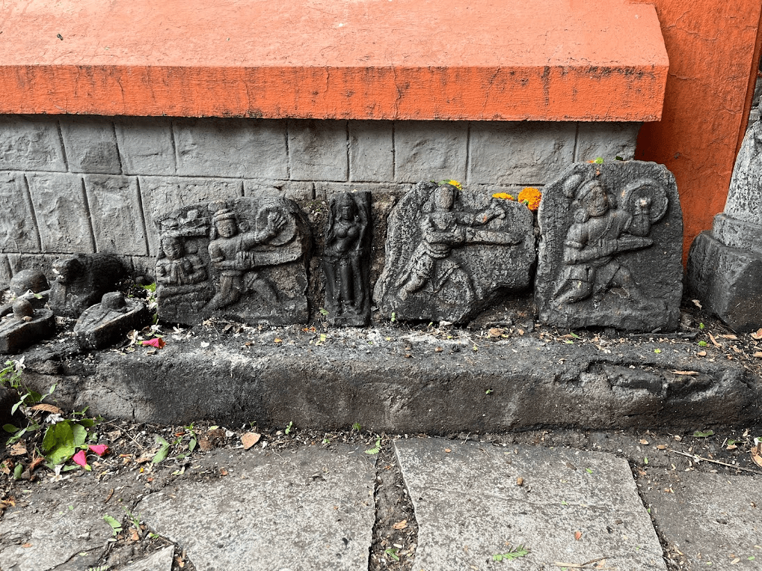 Ancient engravings kept outside the mandir, depicting warriors, that serve as remnants of the mandir's possibly older foundation or past.(Source: CKA Archives)