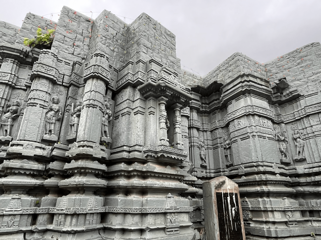Detail of the mandir’s stone exterior, showing both original carvings and areas repaired with cement.The structure continues to undergo maintenance while preserving its historical form. (Source: CKA Archives)