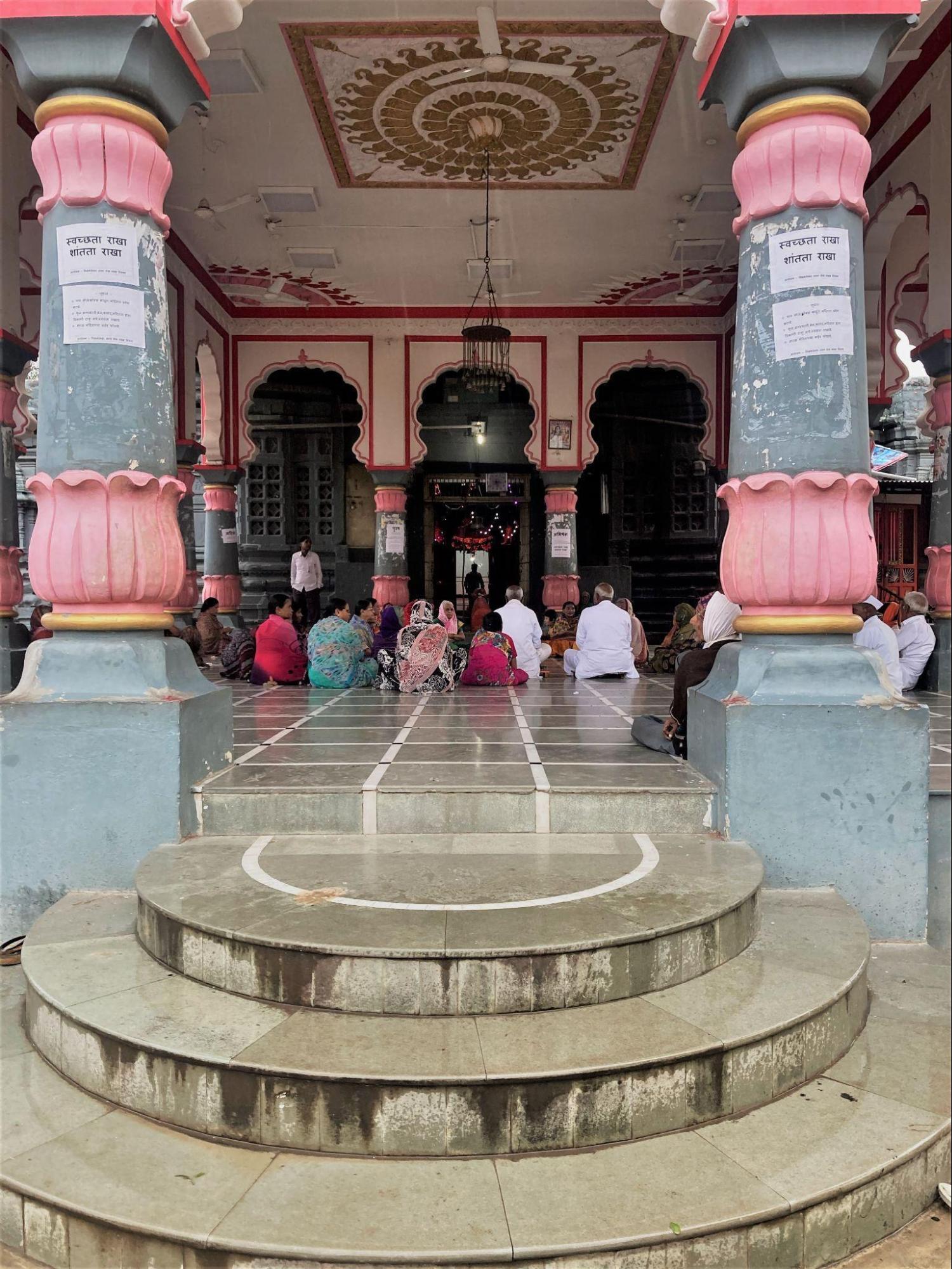 Devotees gathered inside Neelkantheshwar Mandir during a bhajan and kirtan session.The mandir remains an active site of religious practice and community gathering. (Source: CKA Archives)