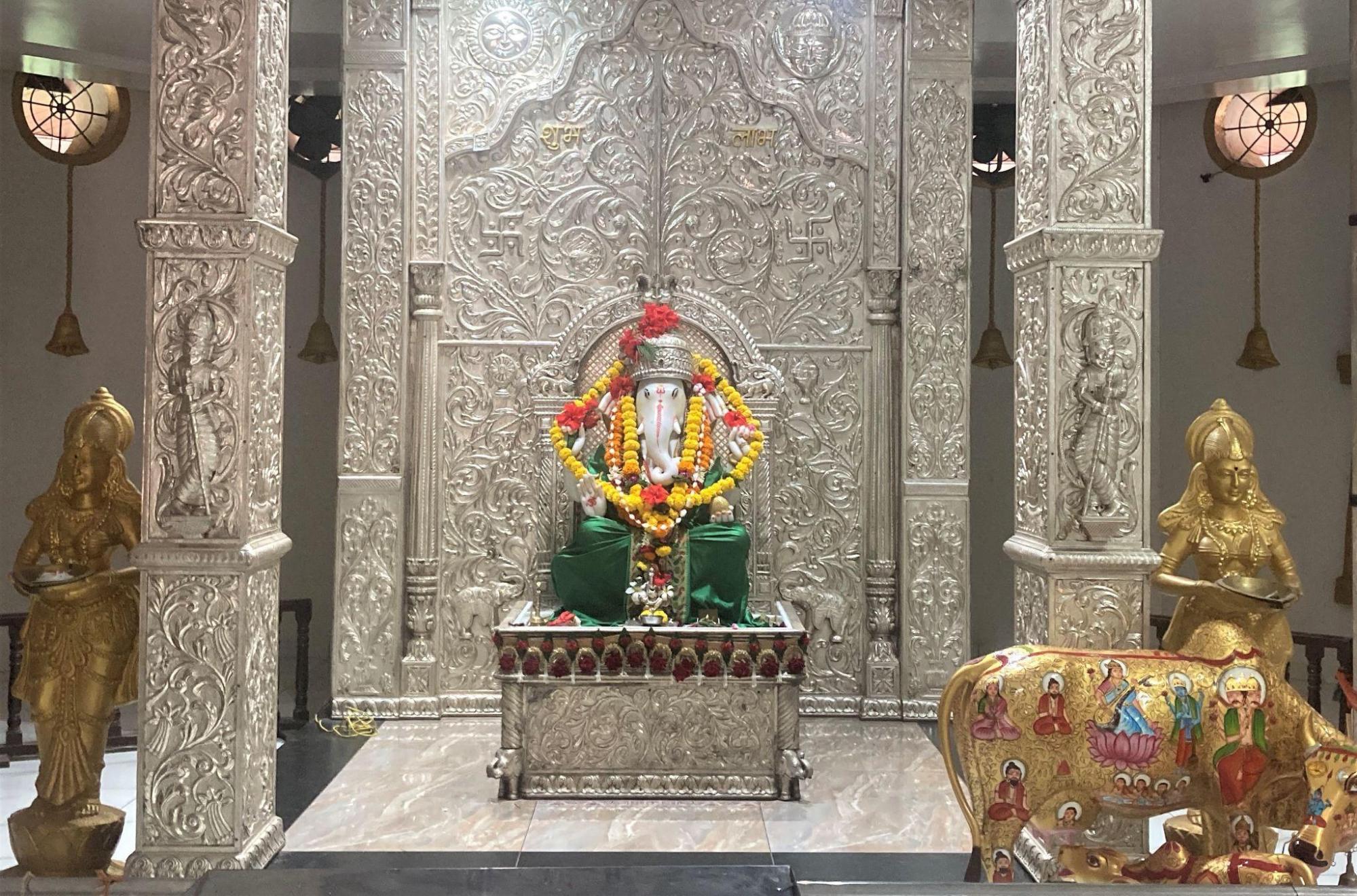Image of Bhagwan Ganesh surrounded by intricate ornaments and offerings at the Ashtavinayak Mandir, Latur. (Source: CKA Archives)
