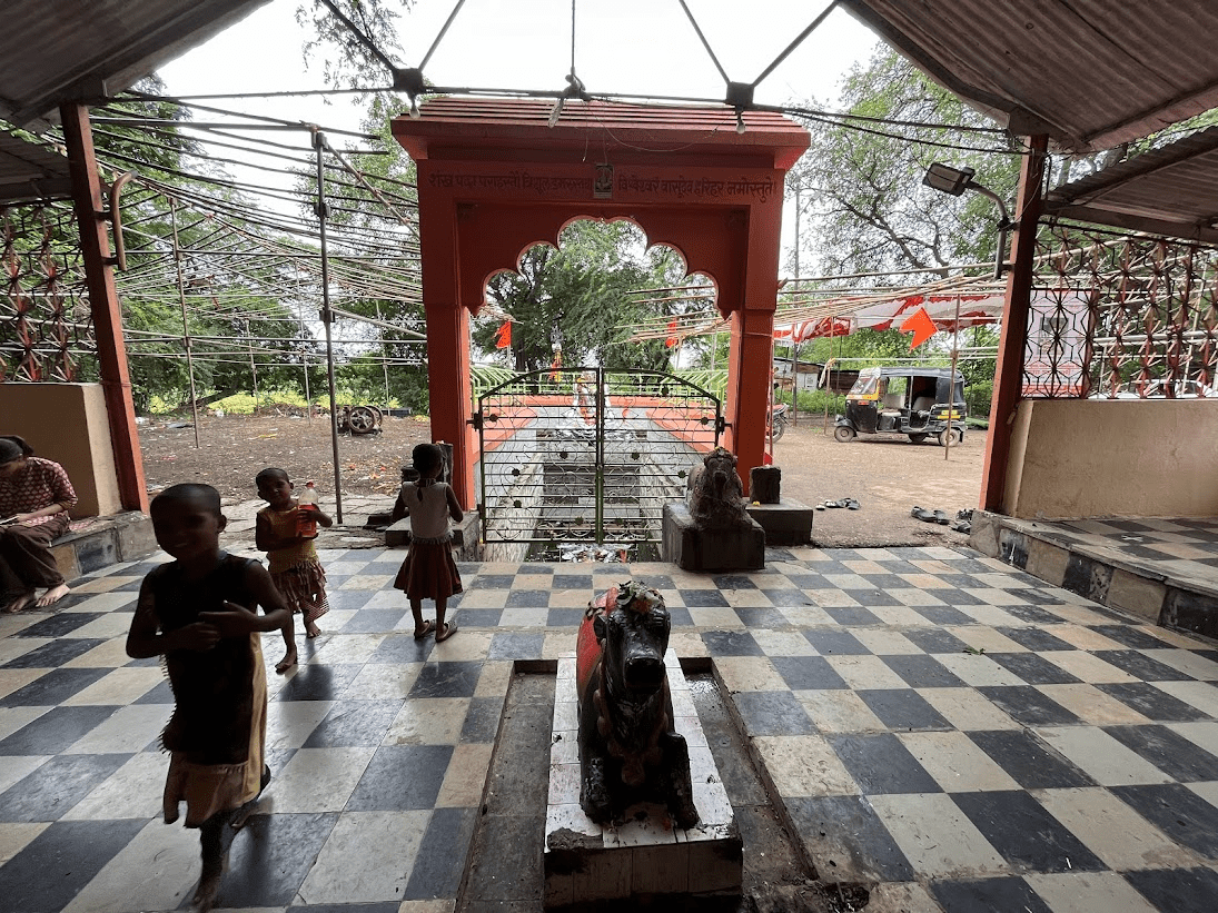 The Bhimashankar Mandir in Ausa, with the seated figure of Nandi placed outside the inner chamber.Children are seen nearby, gathered around Shiva’s vahan (vehicle), which holds an important place in Shaiva mandir layouts. (Source: CKA Archives)