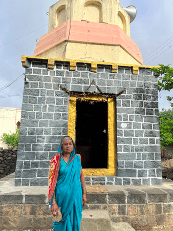 The Vitthal Rukmini Mandir in Budhuda village, with the current pujarin standing in the foreground.The mandir has been looked after by the same family for over two generations and continues to play an active role in the religious life of the village. (Source: CKA Archives)