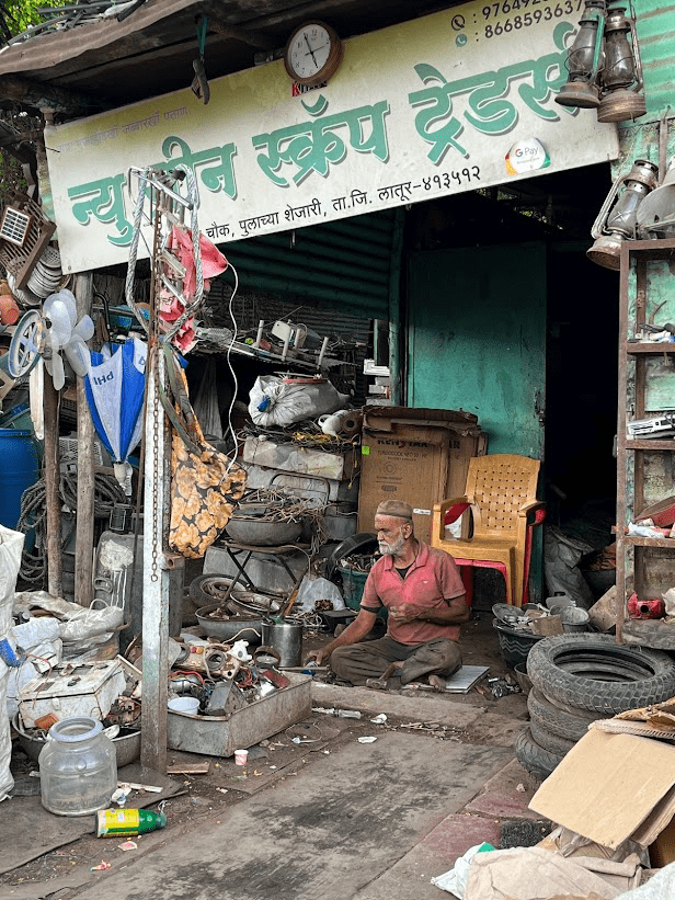 A worker checking the functionality of items bought by the scrap store, aiming to extract as much use of an item as they can (Source: CKA Archives)