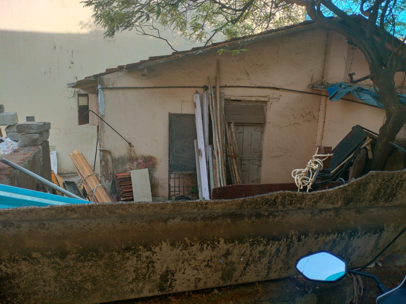 Exterior view of the pitched roofing system made from corrugated metal sheets, aligned with the slope of the land. (Source: CKA Archives)