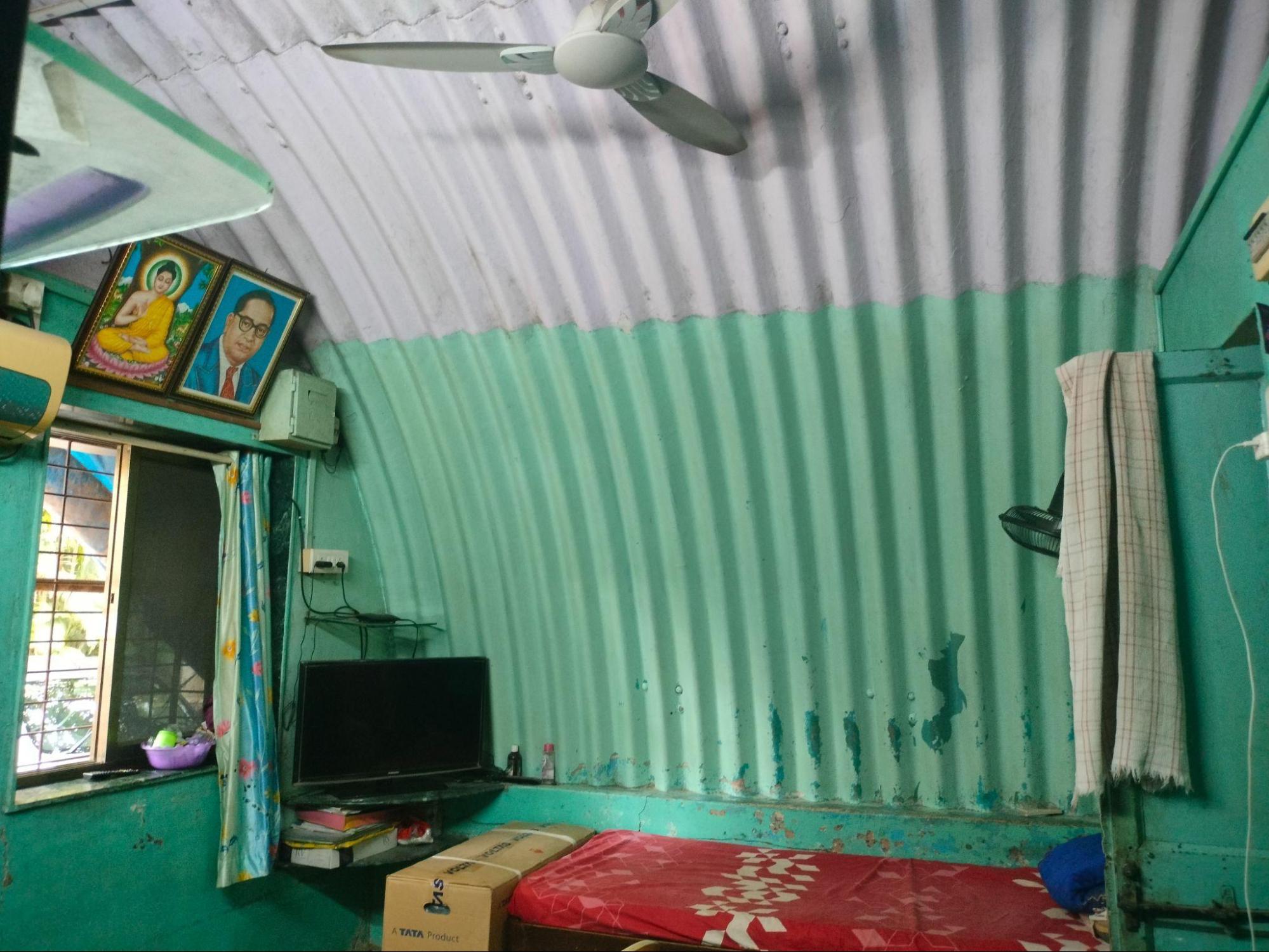 Interior spaces flow into each other, with corrugated roofing forming a continuous curved shell overhead, eliminating the need for a separate truss or rafter system. (Source: CKA Archives)