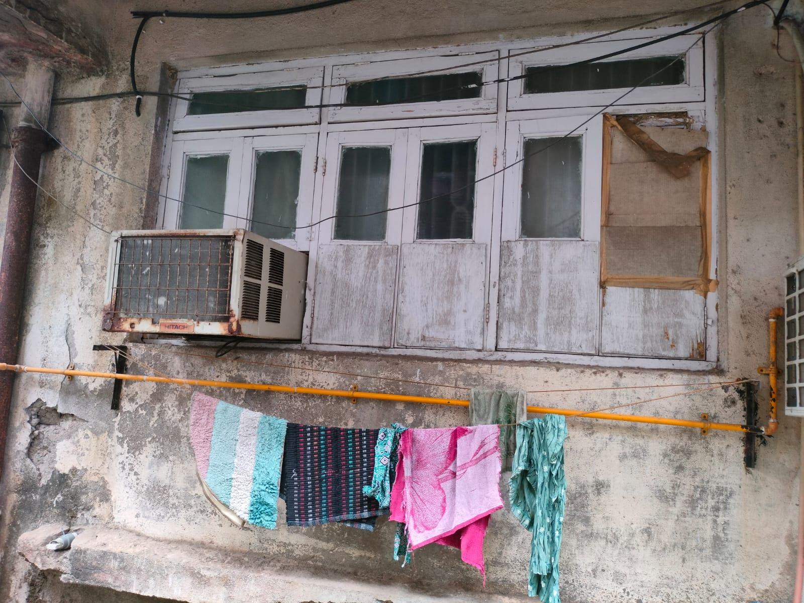 While the windows have been renovated, they originally featured wooden double panels with ventilation slots above such as the one that remains here. This window design was a common feature in buildings of this era. (Source: CKA Archives)