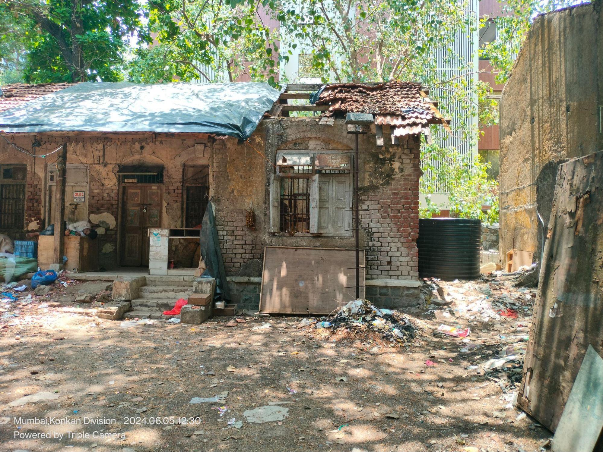 Wooden triangular motif below the sloping roof, possibly symbolic. This feature recurs in other homes nearby. (Source: CKA Archives)
