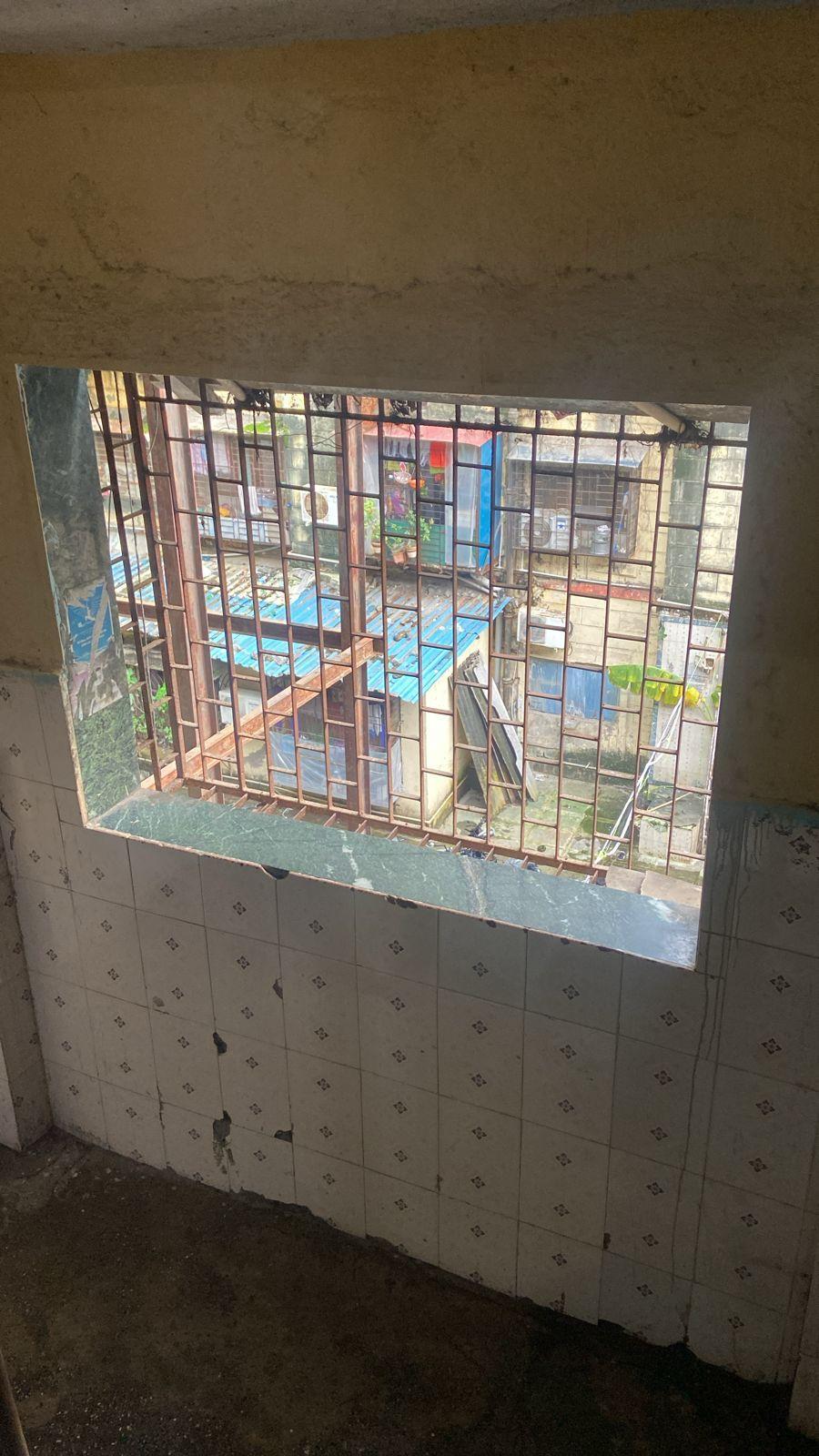 Box-type windows with granite framing and mild steel grills. Source: CKA Archives