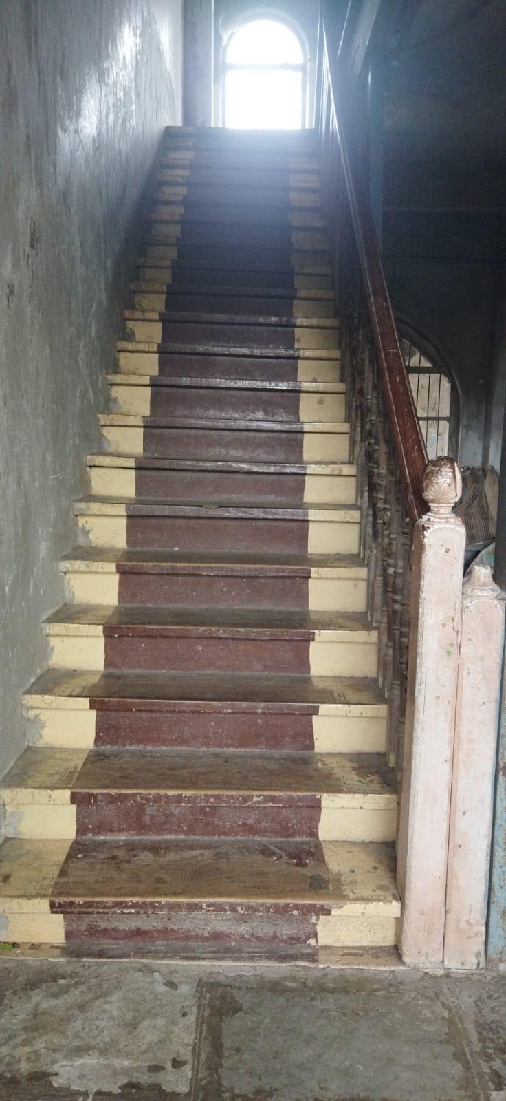 Brightly painted wooden staircases with carved balusters. Source: CKA Archives