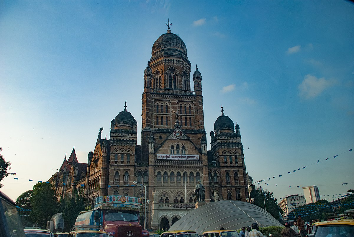 Victorian Gothic BMC Building with pointed arches, turrets, domes, and carvings blending Western and Indian motifs.[13]