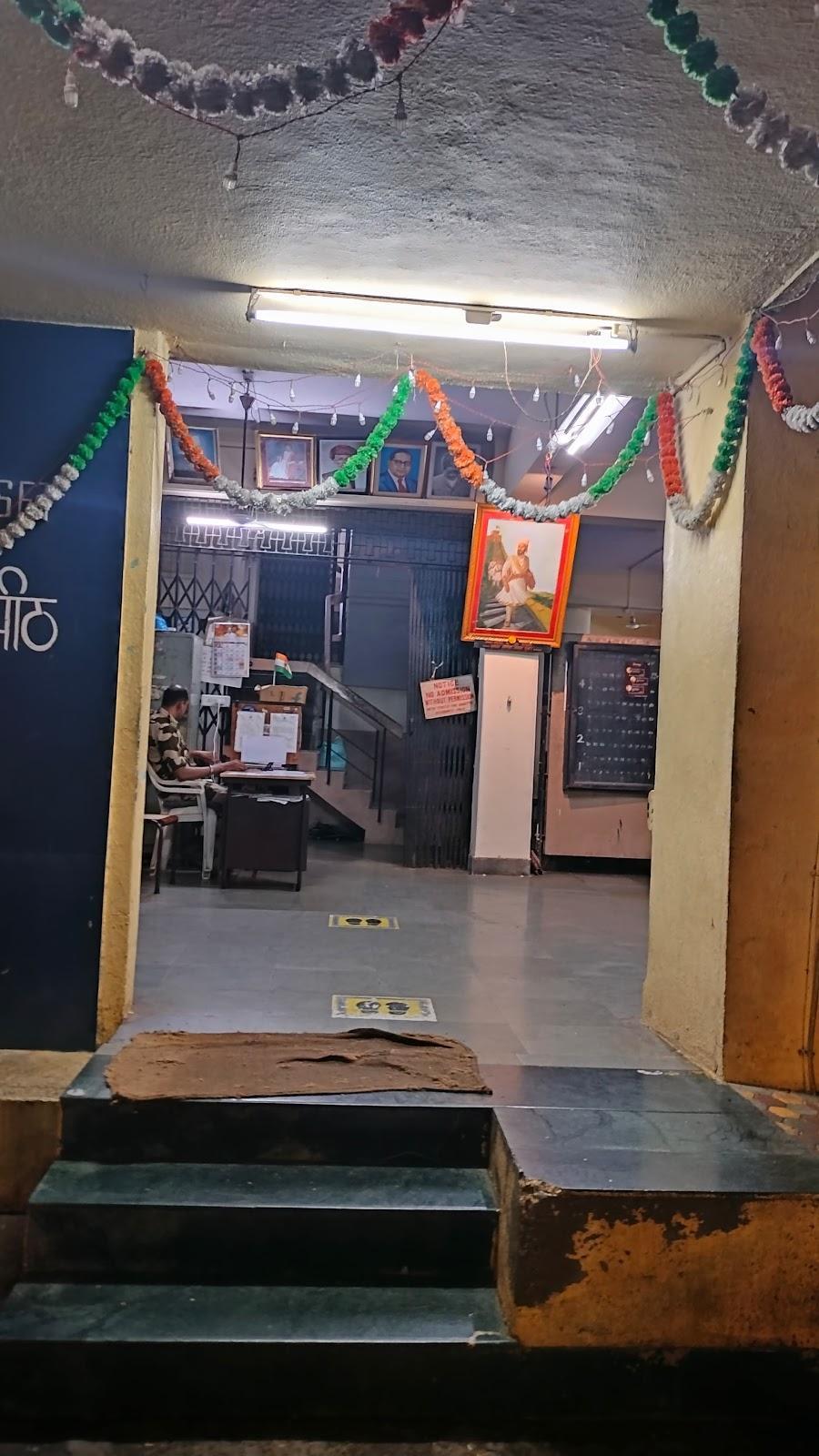 Wide entrance to the hostel featuring stone-finished staircases and a bright blue color. Source: CKA Archives