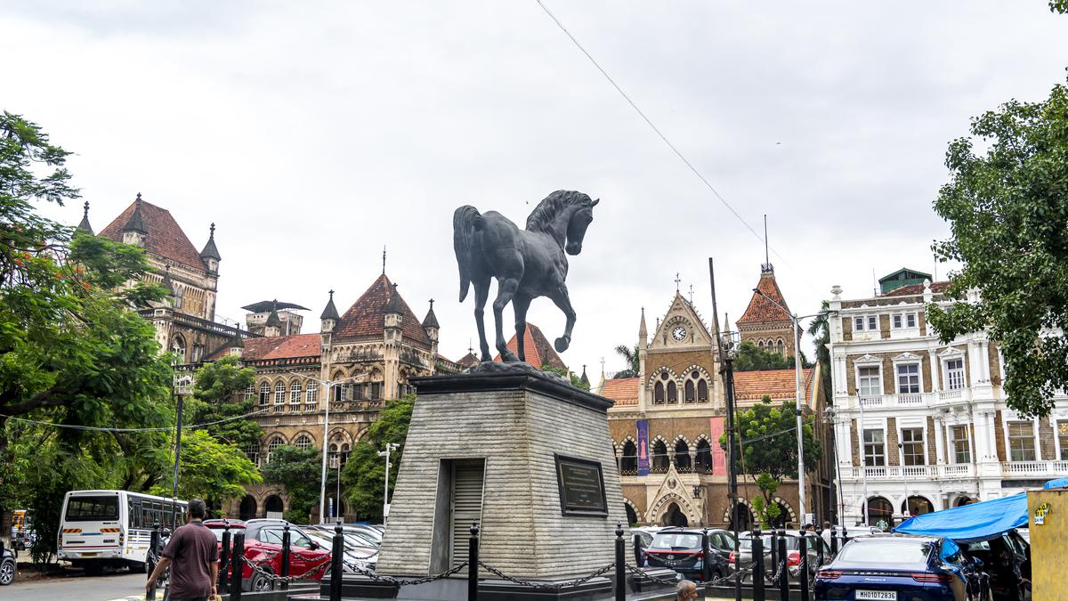 Kala Ghoda’s black horse statue, surrounded by colonial-era buildings, marks the heart of South Mumbai’s art and heritage district.[9]
