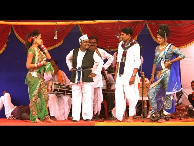 A Khadi Gammat performance engaging the audience with music and humor during a cultural celebration.[1]