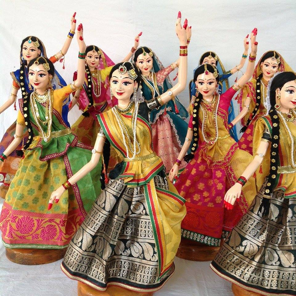 Papier-mache dolls created by Ramani Rao, depicting traditional Indian attire and cultural themes.[8]