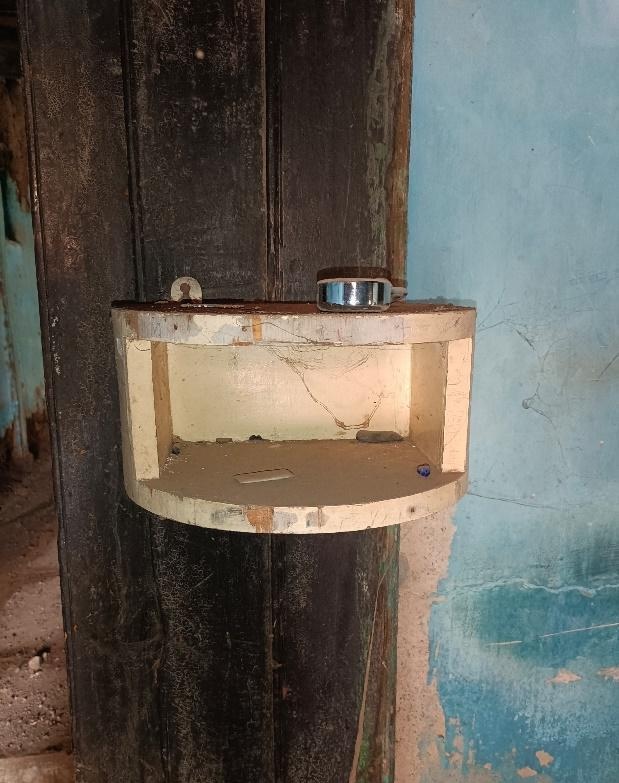 A protruding wooden shelf-style cupboard, built externally from the wall. (Source: CKA Archives)