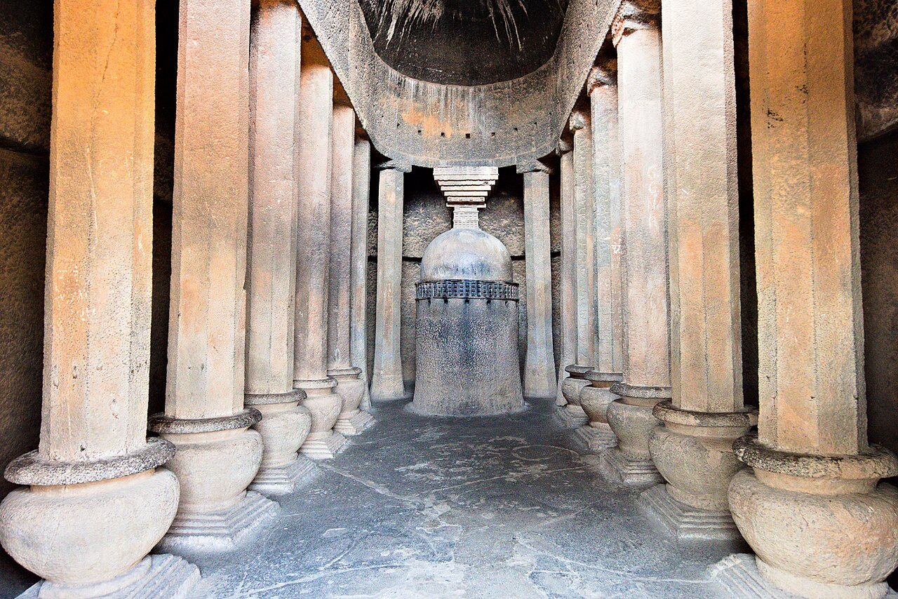 Interior of Cave 18, the chaitya griha, showing the central stupa and supporting pillars used for communal worship.[2]