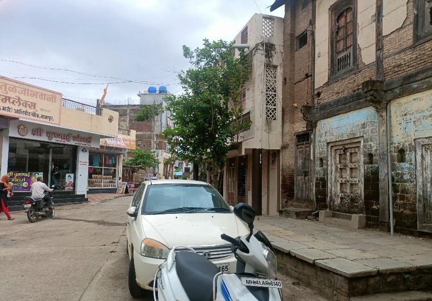 Street view showing the wada’s entrance in its urban context. Additionally, notice the many gates that stand at the entrance of the property. (Source: CKA Archives)